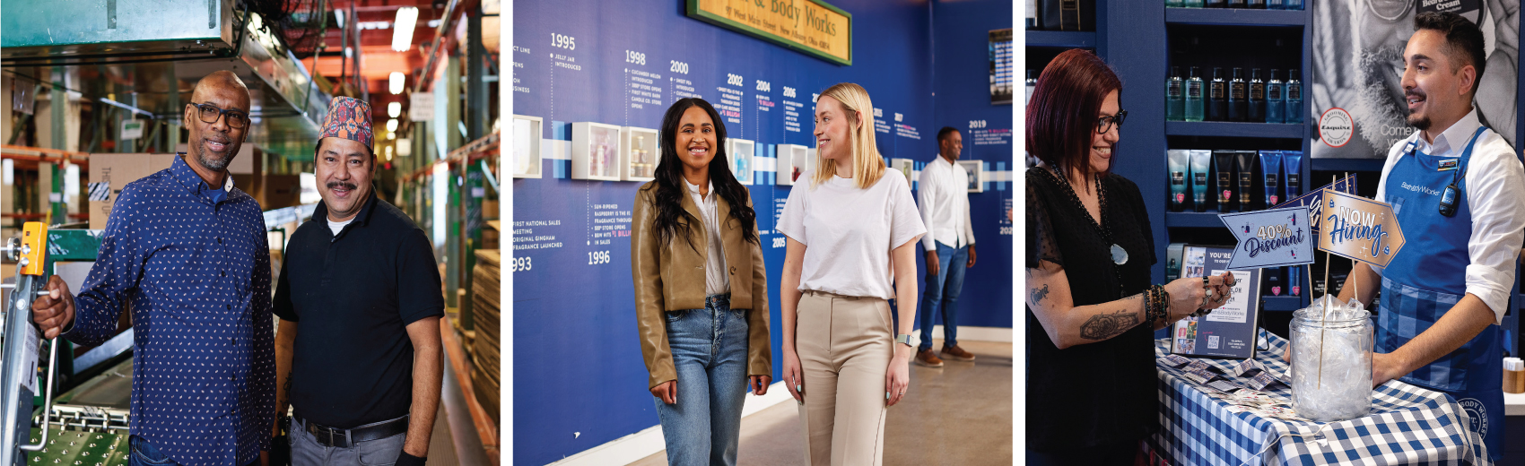 A Bath & Body Works associate in a blue gingham apron chats and smiles with a candidate at a now hiring display in-store. A Bath & Body Works associate smiles in front of a wall of products. A Bath & Body Works associate smiles and shows a customer hand soaps at the in-store sink.